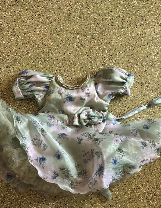 Floral dress with puff sleeves on a textured surface