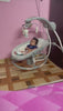 Soothe and entertain your baby with the INGENUITY Baby Electric Swing in Grey, featuring multiple speed settings, recline positions, and built-in melodies for customizable comfort and convenience.