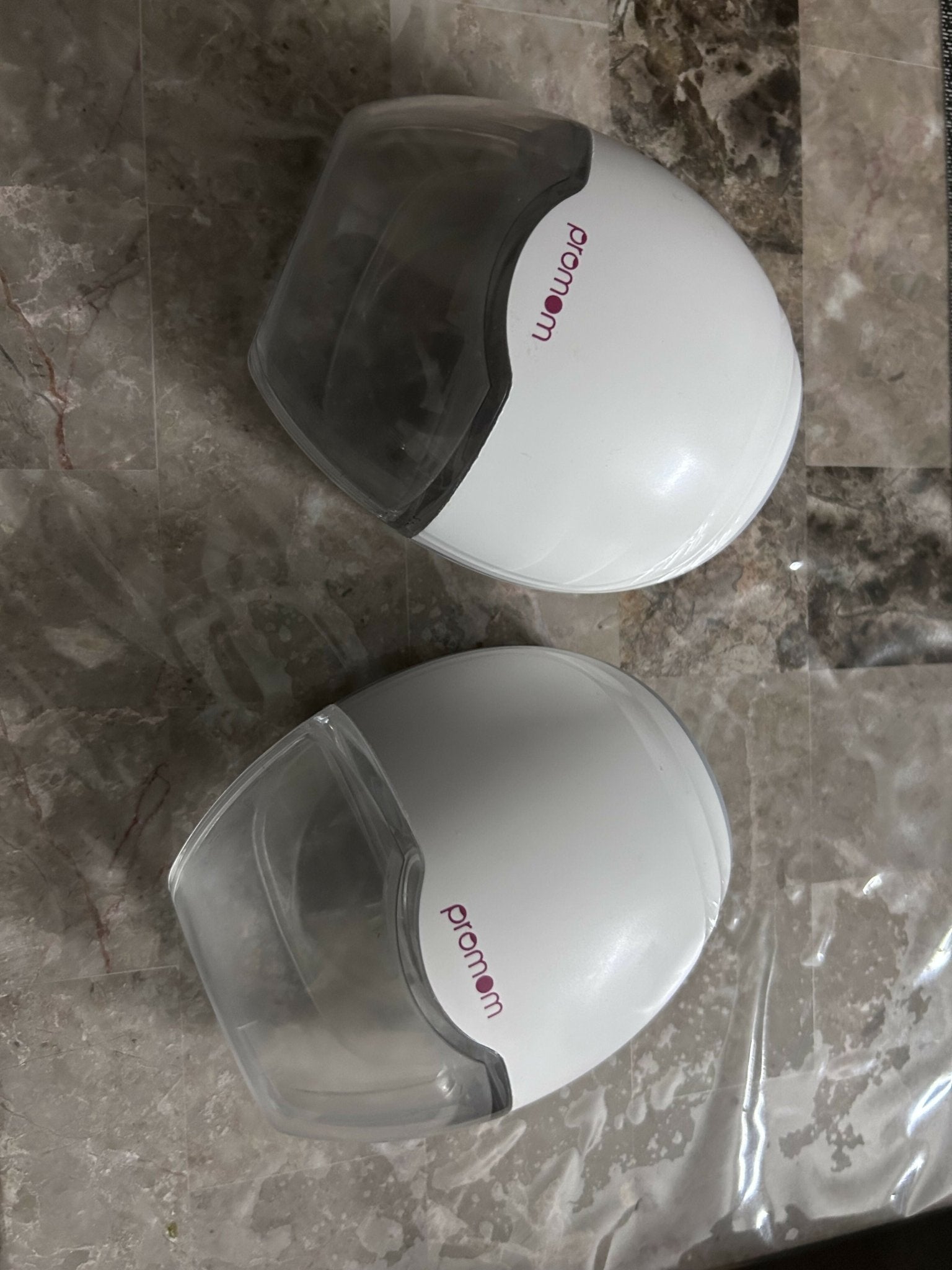 PROMOM wearable breast pump with hands-free design, adjustable suction levels, lightweight collection cups, rechargeable operation, and comfortable milk expression support for breastfeeding mothers.