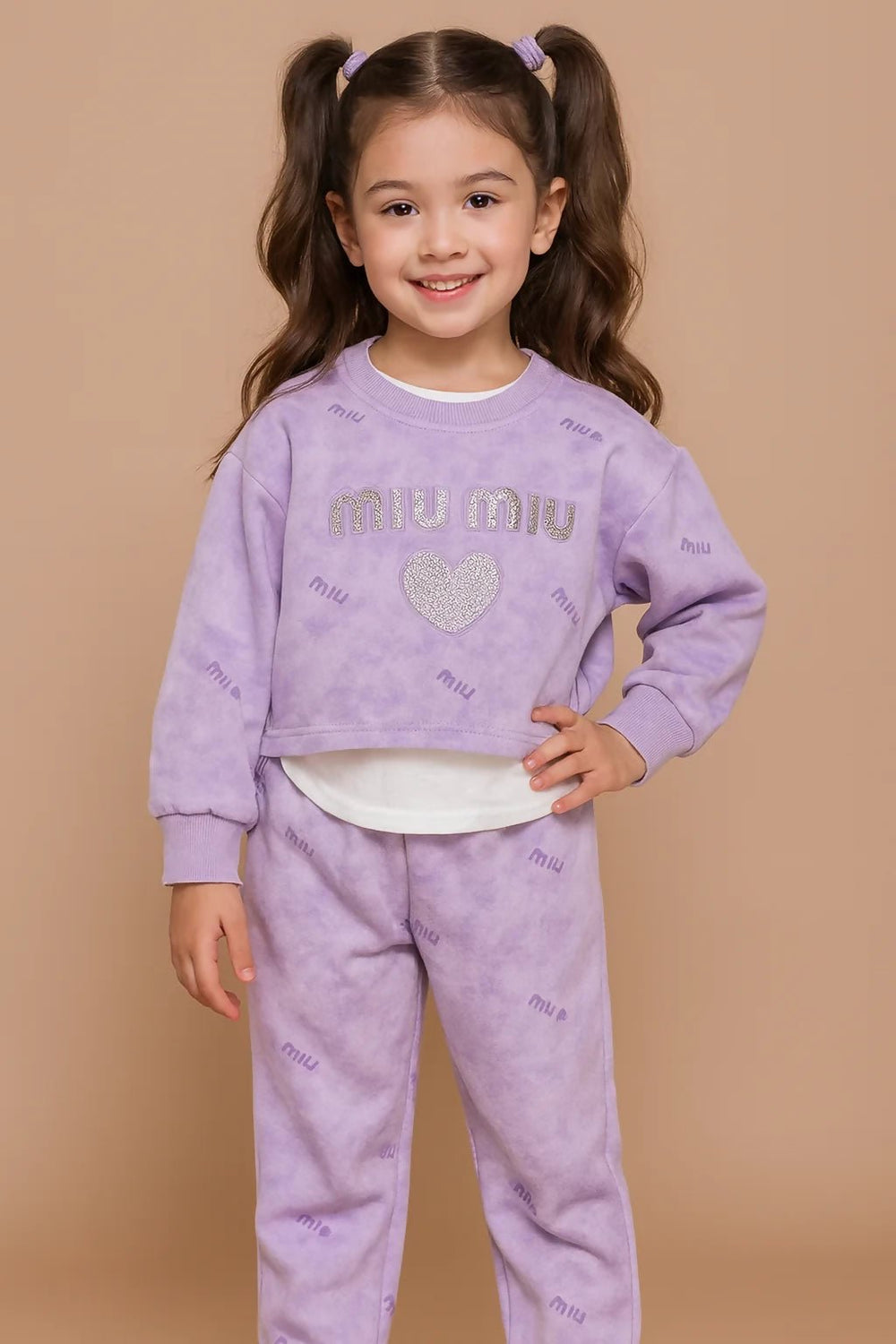 Young girl wearing a purple 'Miu Miu' outfit 