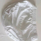 White shower cap on a white background
