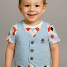 Child wearing a patterned shirt and light blue vest