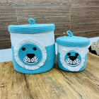 Two blue and white bear-themed storage baskets 