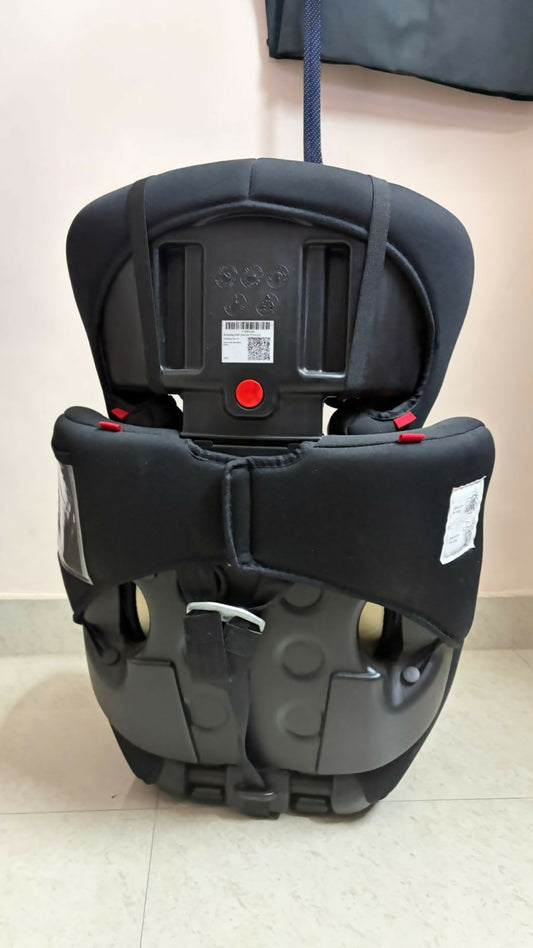 Black and gray car seat on a light-colored floor