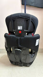 Black and gray car seat on a light-colored floor