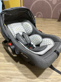 Gray baby car seat with patterned seat cover 
