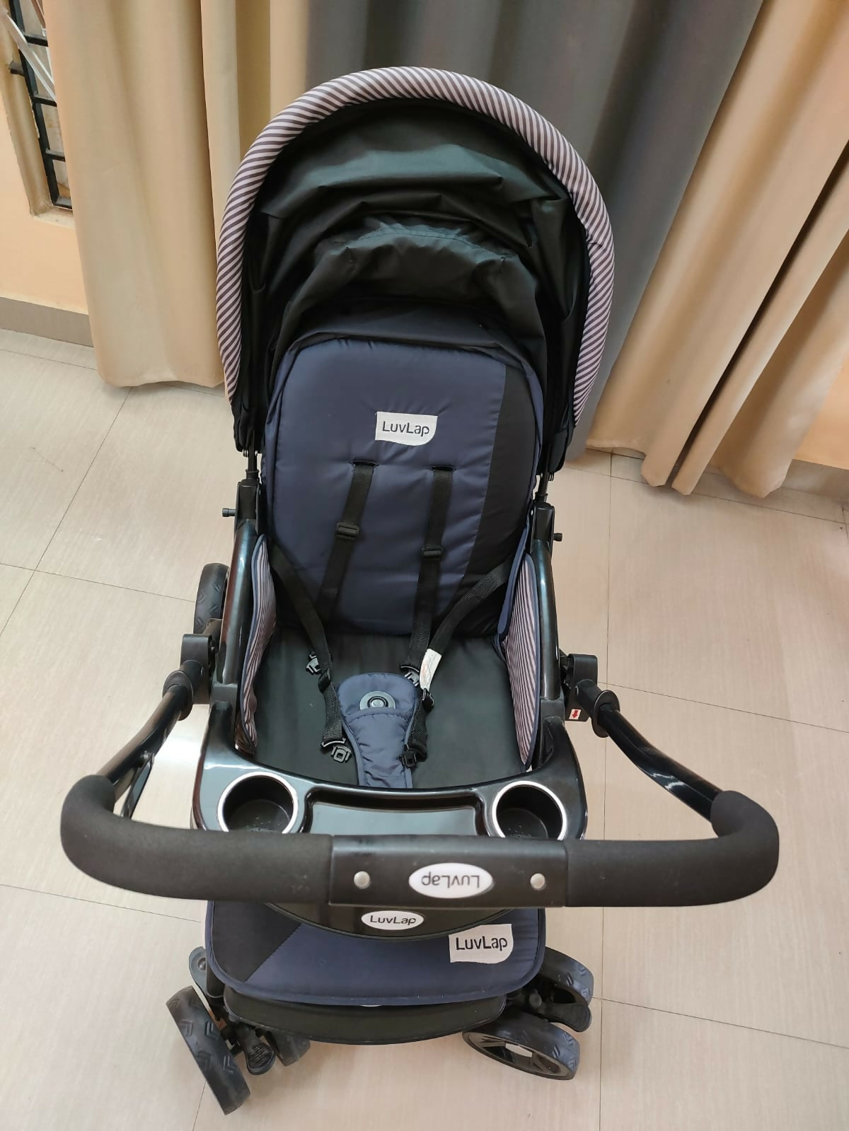 Buy LuvLap Baby Stroller – Safe, foldable pram with reclining seat, safety harness, and storage basket for newborns and toddlers.
