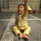 Child in a yellow outfit 