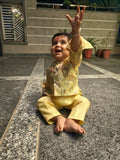 Child in a yellow outfit 