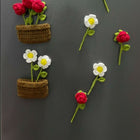 Floral and basket-shaped crochet magnets 