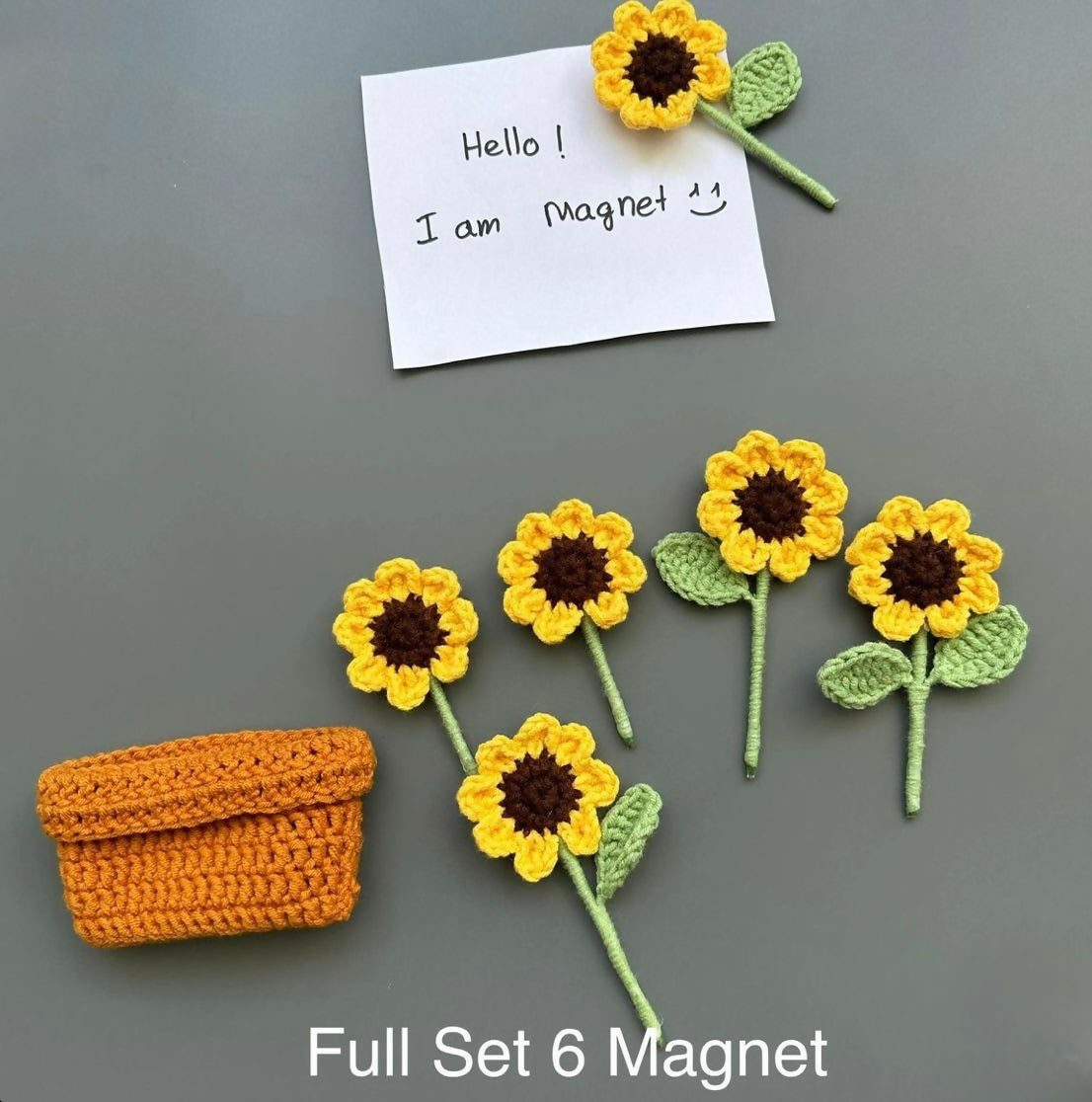 Set of sunflower-shaped magnets with a small orange basket 