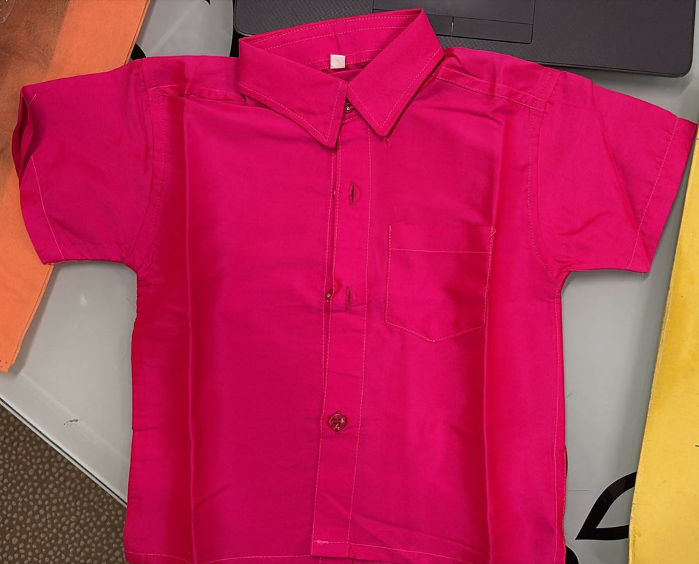 Pink jacket on a table with a colorful background