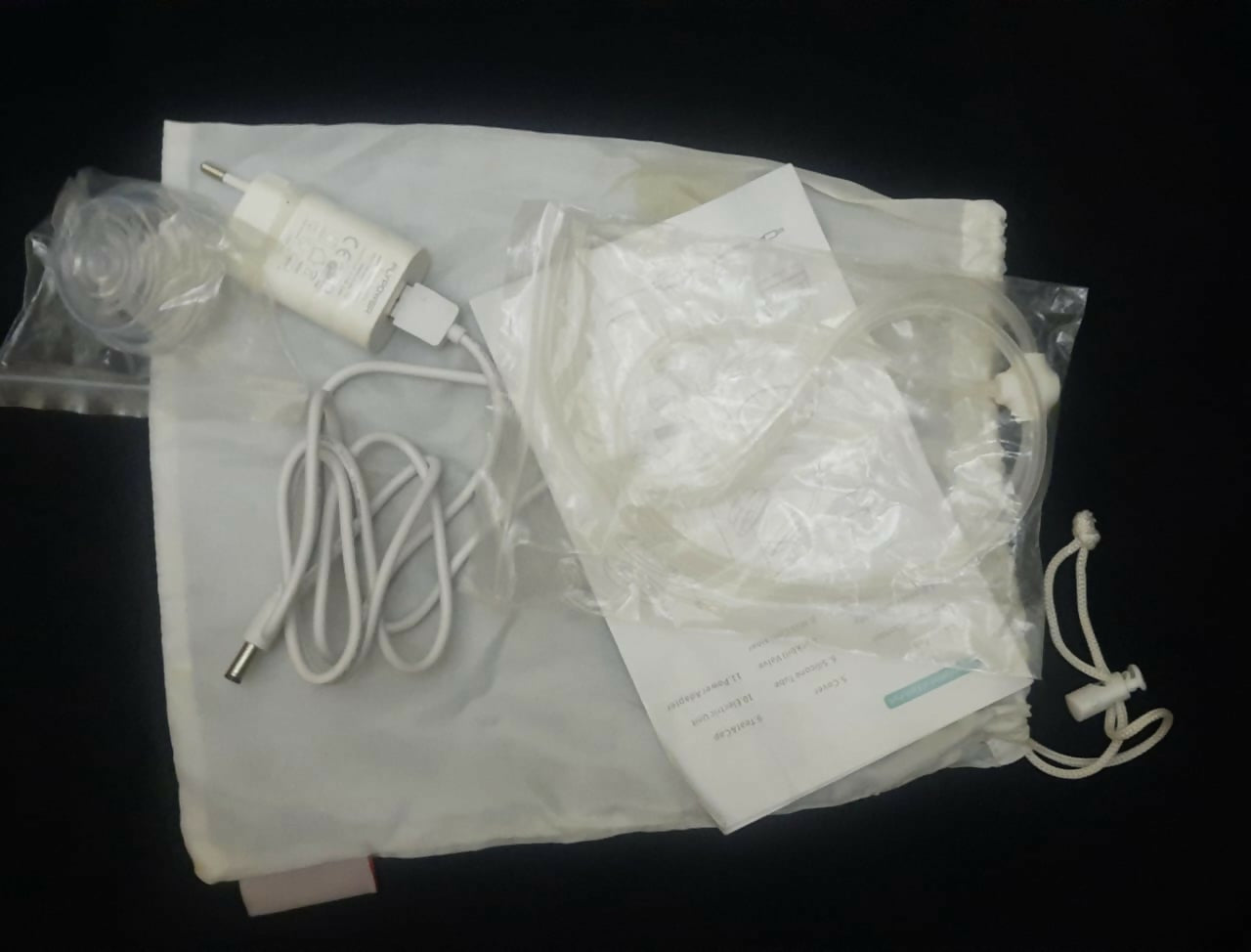 Medical equipment with tubing and connectors on a black background