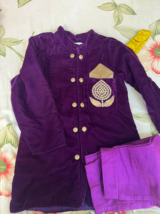 Elegant purple baby sherwani with intricate detailing, soft fabric, and comfortable fit, perfect for festive occasions and celebrations.