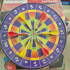 Magnetic dartboard with darts on a colorful target
