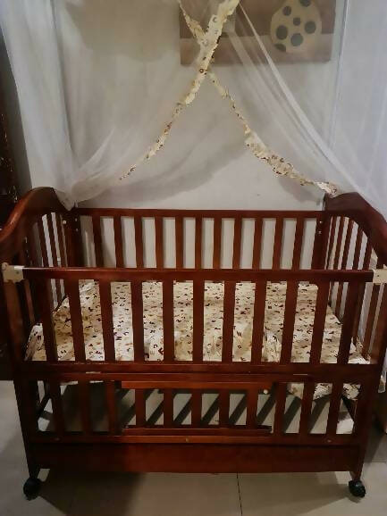 Create a safe and cozy haven for your little one with our Cot/Crib - where sweet dreams begin!