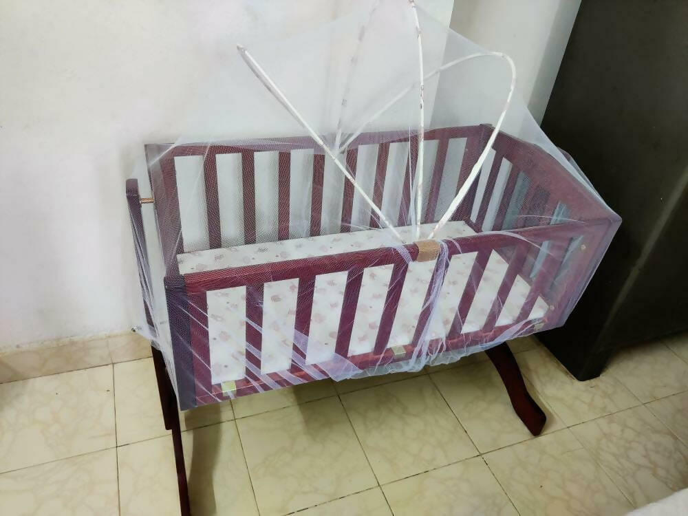 Keep your baby safe and snug with the LUVLAP C-10 Baby Wooden Cradle with Mosquito Net—a must-have addition to any nursery for blissful sleep.
