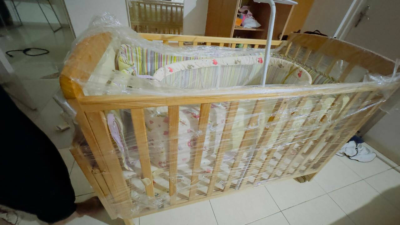 Create a safe haven for your baby with our durable and stylish cot - easy assembly, premium materials, and mosquito net included!