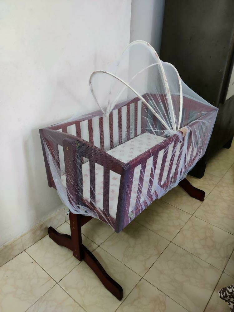 Keep your baby safe and snug with the LUVLAP C-10 Baby Wooden Cradle with Mosquito Net—a must-have addition to any nursery for blissful sleep.