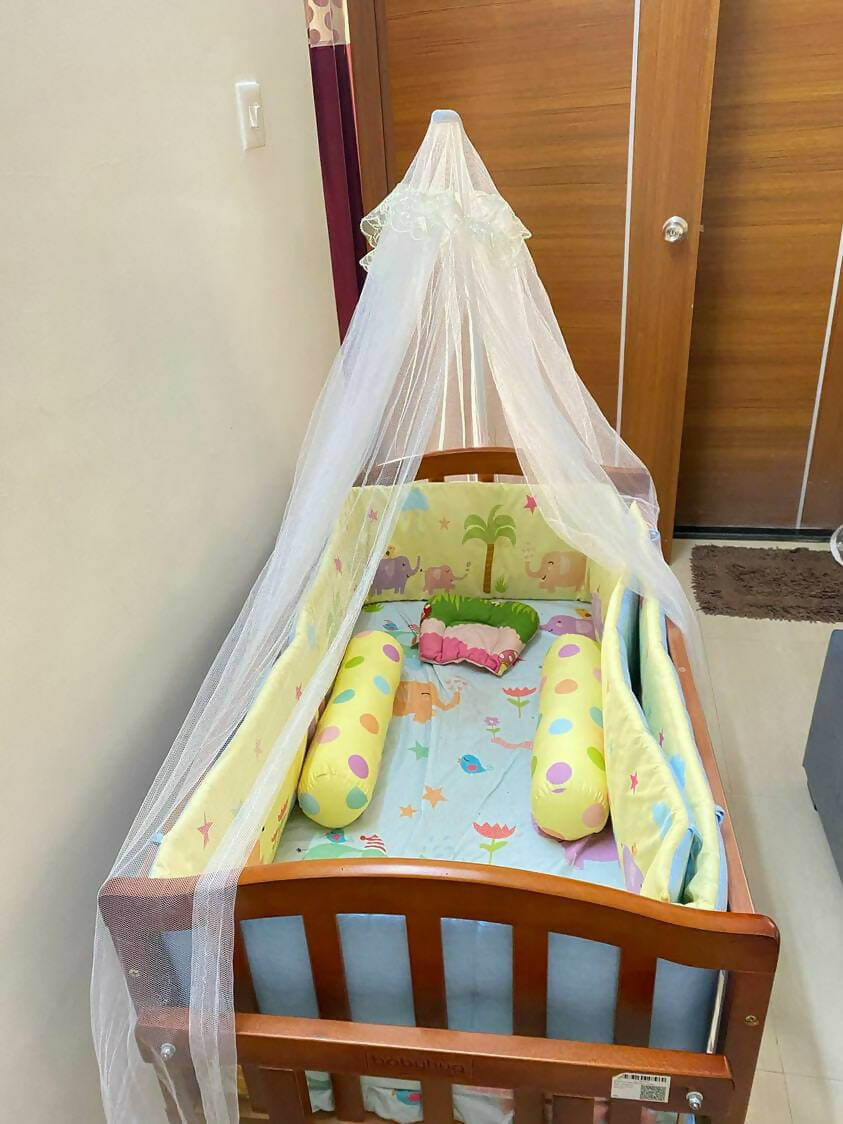 Introducing the BABYHUG Cradle with Mosquito Net and Mattress—a complete sleep solution for your little one's comfort and safety.